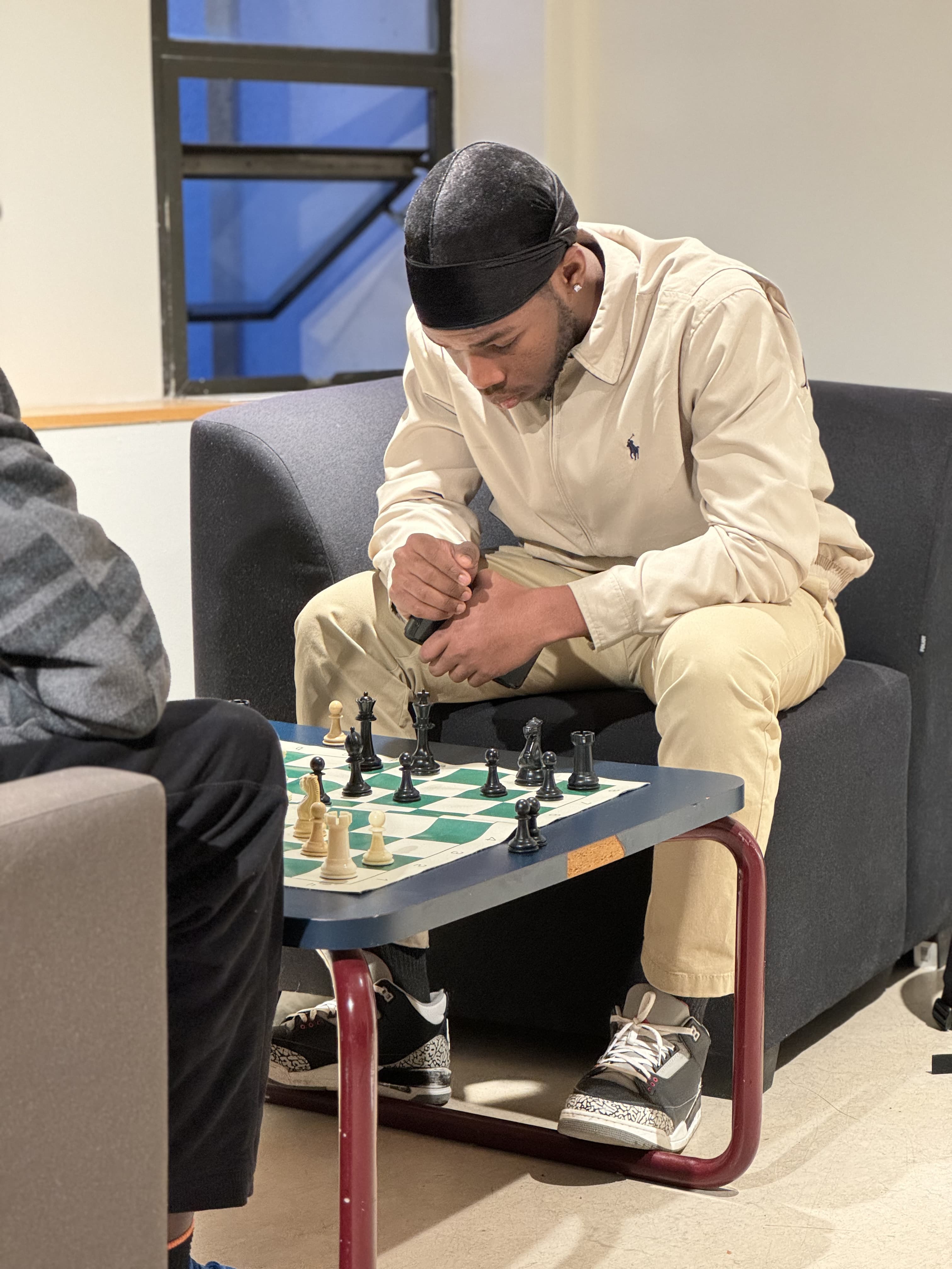 Maxime deep in thought while playing chess